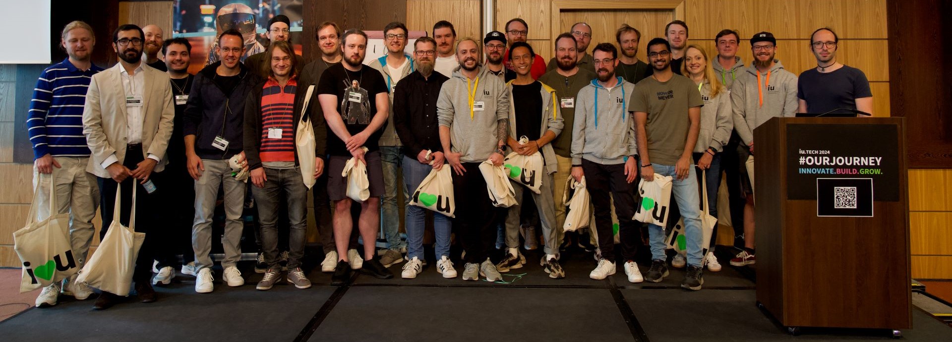 A conference picture of several speakers with Pedro in the middle